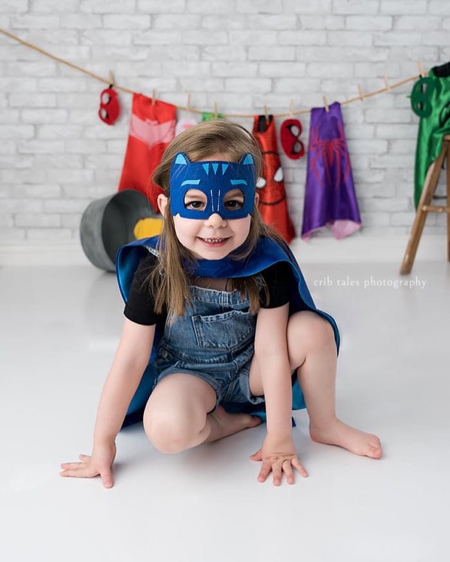 Denver Children's Photographer - Crib Tales Photography. Small child with superhero costumes